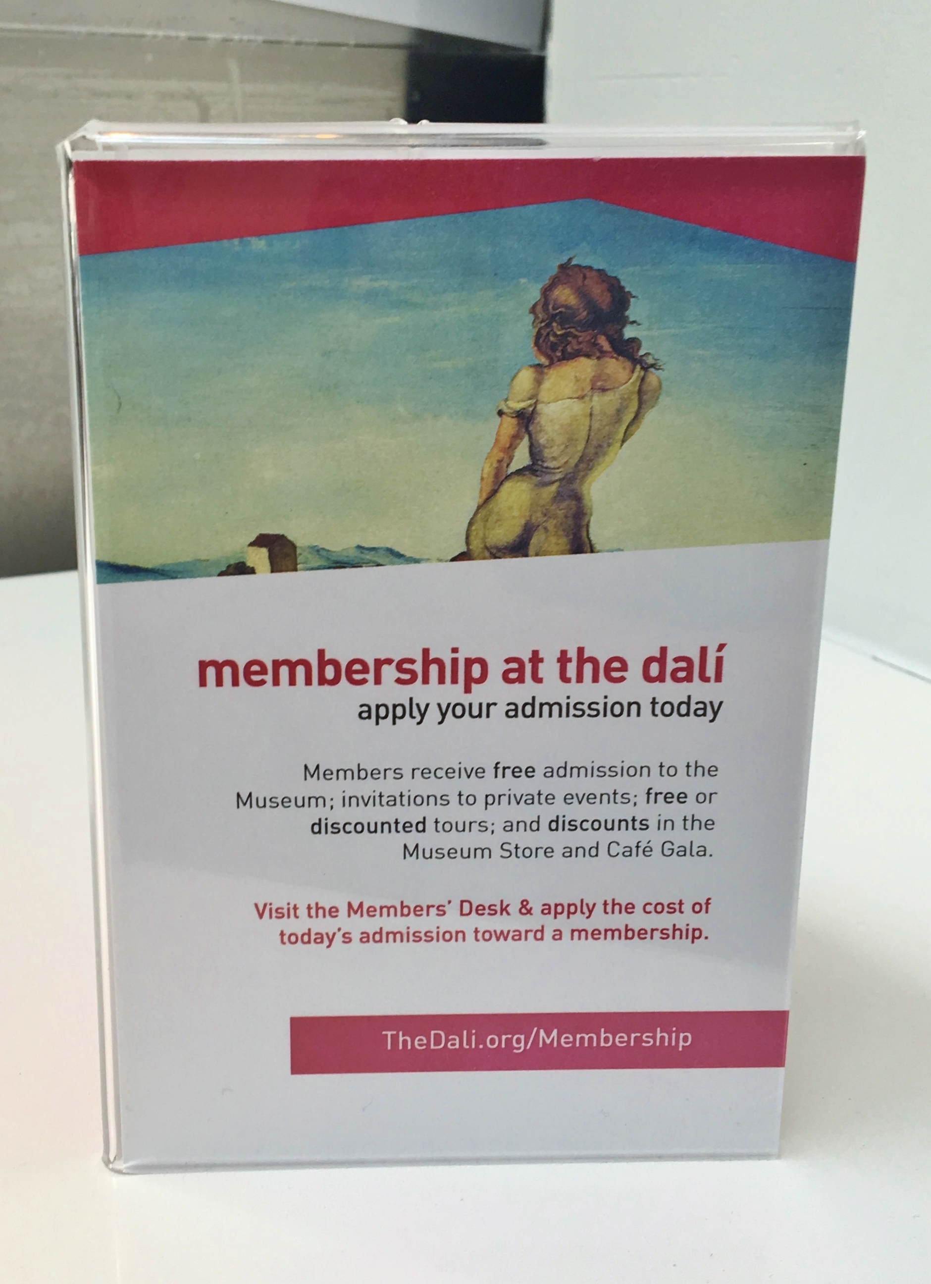 Another insert with another of Dali's painitngs and the same red angular shape, advertising membership benefits.